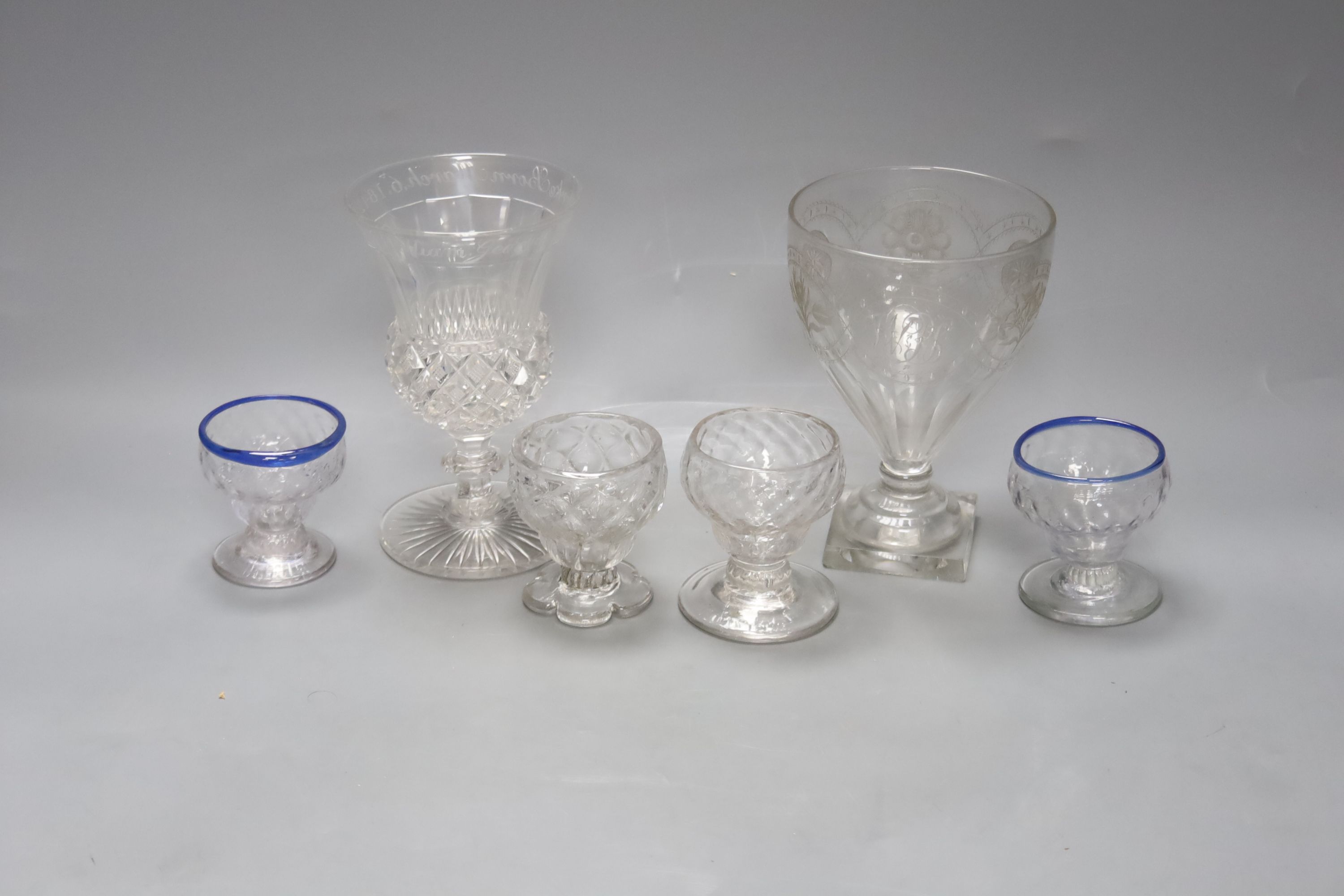 Four 18th century sweetmeat glasses, two with applied blue cable, a George III rummer and an 1842 commemorative goblet